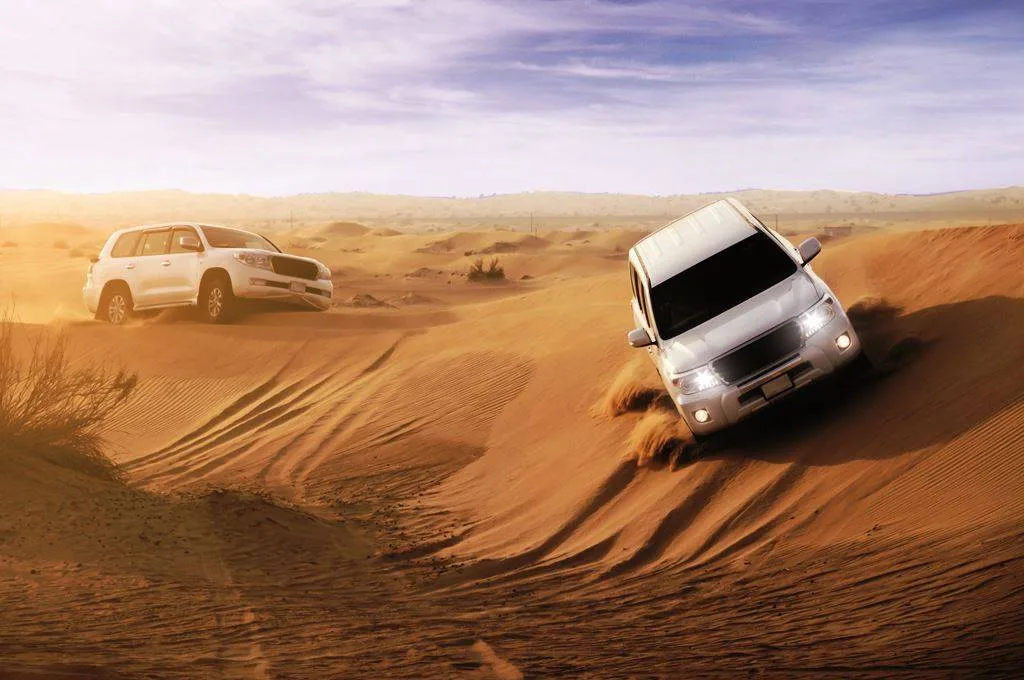 4x4 Convoy Crossing the Dunes
